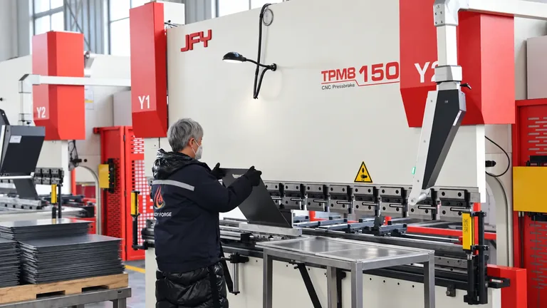 Metal bending press in the workshop