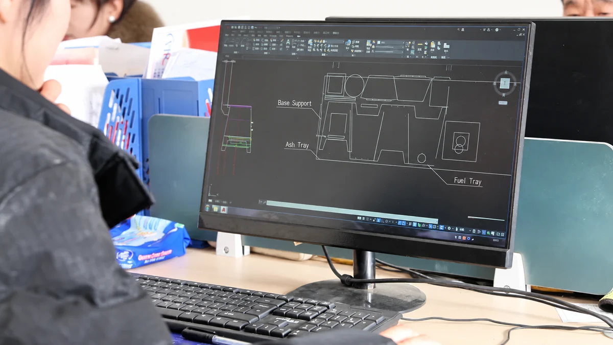 Reviewing CAD component drawings at Kingjoy Forge, with English component labels